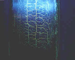 Crankshaft main journal,with cracks clearly visible after crack testing and only visible under ultra violet light.
